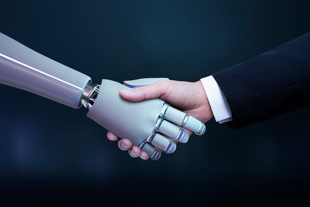 KI Einsatz im Unternehmen Beitragsbild. Roboter und menschliche Hand beim Handschlag